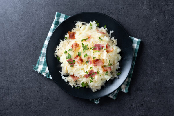 Slovak potato dumplings halusky with steamed sauerkraut and baco Pasta Carbonara
